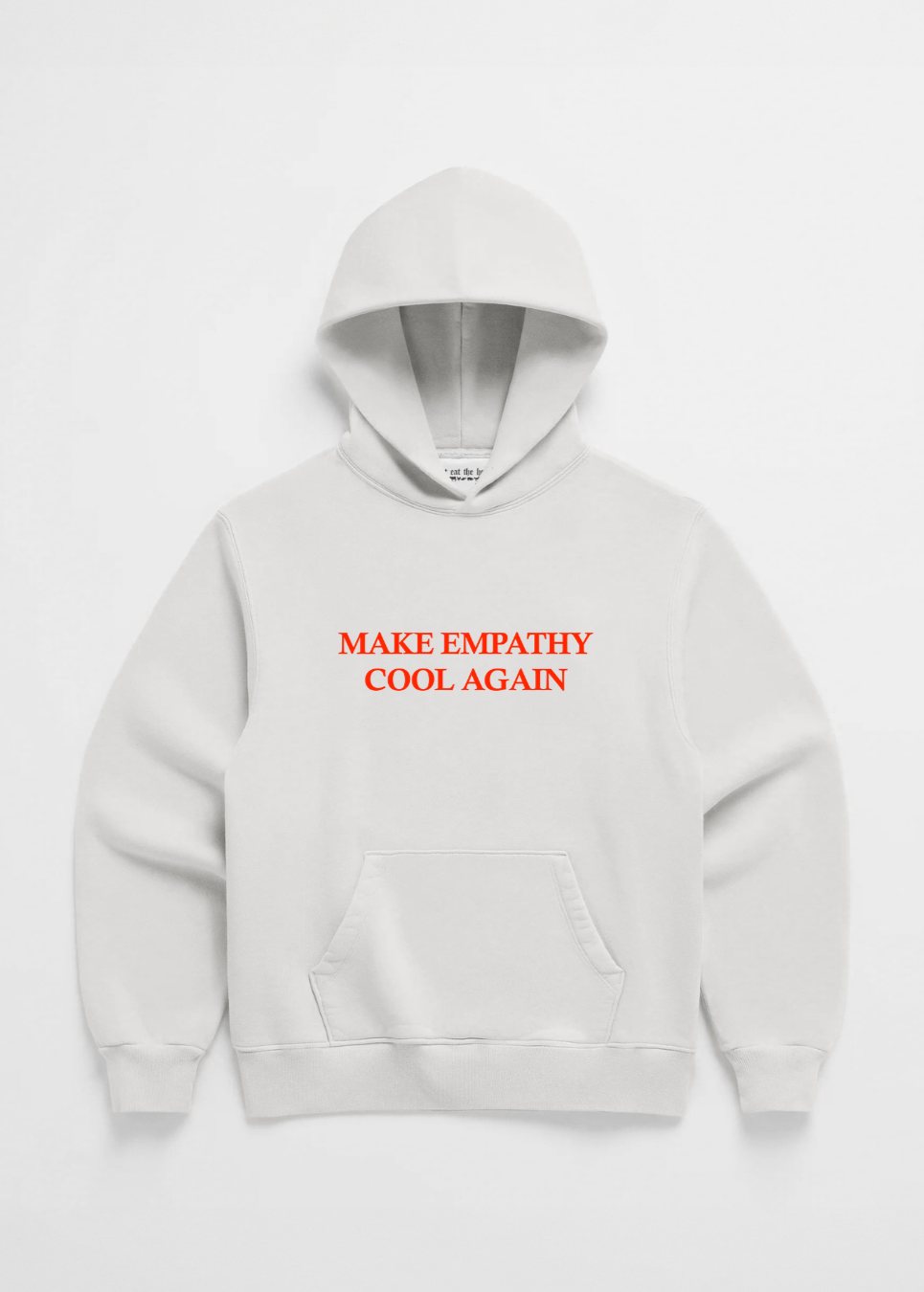 A pink hoodie with the text 'MAKE EMPATHY COOL AGAIN' printed in red on the front center chest area.