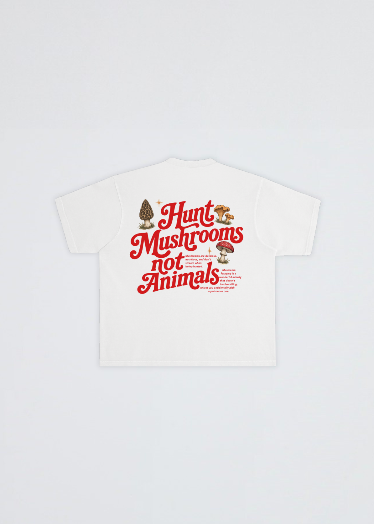 A beige short-sleeve t-shirt shown flat against a light gray background, featuring a graphic on the back with the text 'Hunt Mushrooms not Animals' in red, accompanied by illustrations of a morepenny and mushrooms.