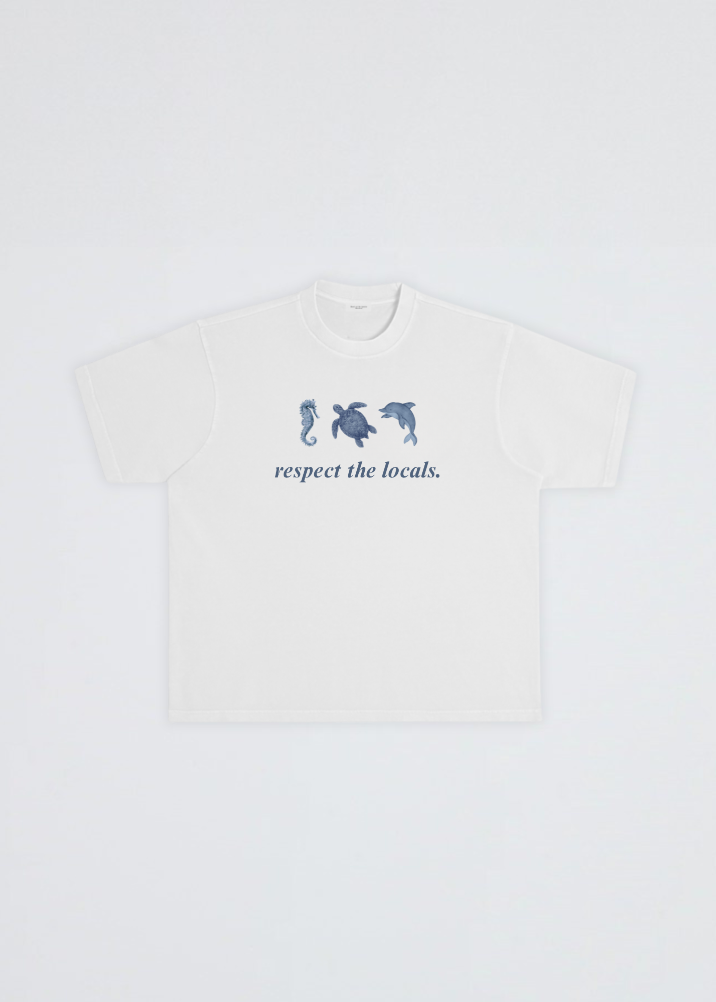 A white short-sleeve crewneck t-shirt featuring a blue graphic of three sea creatures (seahorse, turtle, dolphin) above the text 'respect the locals.' on the chest, displayed flat against a light gray background.